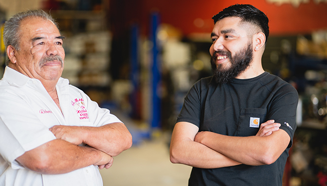 Business owners crossing arms and smiling