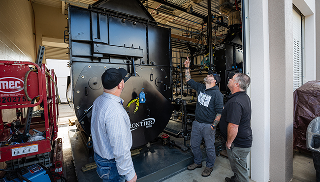 Man pointing at commercial equipment