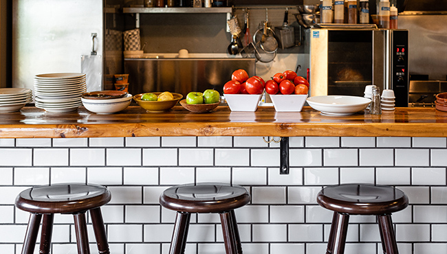 Bar stools at restaurant counter