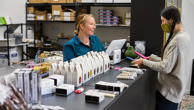 Customer checking out at candy store