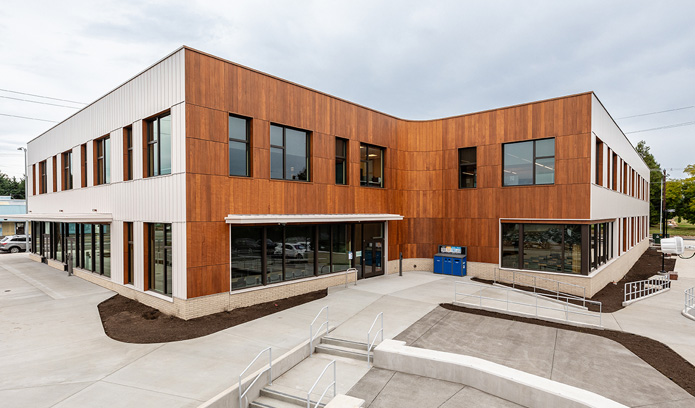 PCC Metro Opportunity Center showcasing metal and wood siding on cloudy day