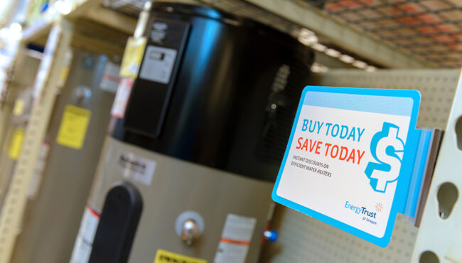 Discount sign next to a water heater in a retail setting