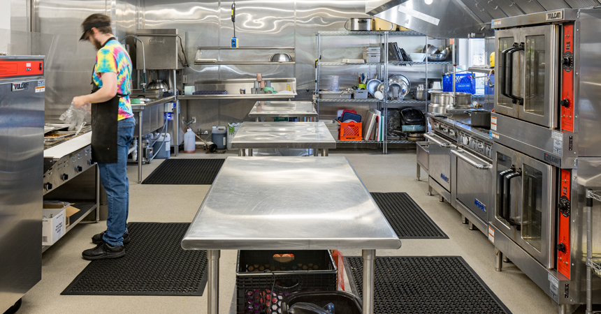 Man preparing food in a commercial kitchen